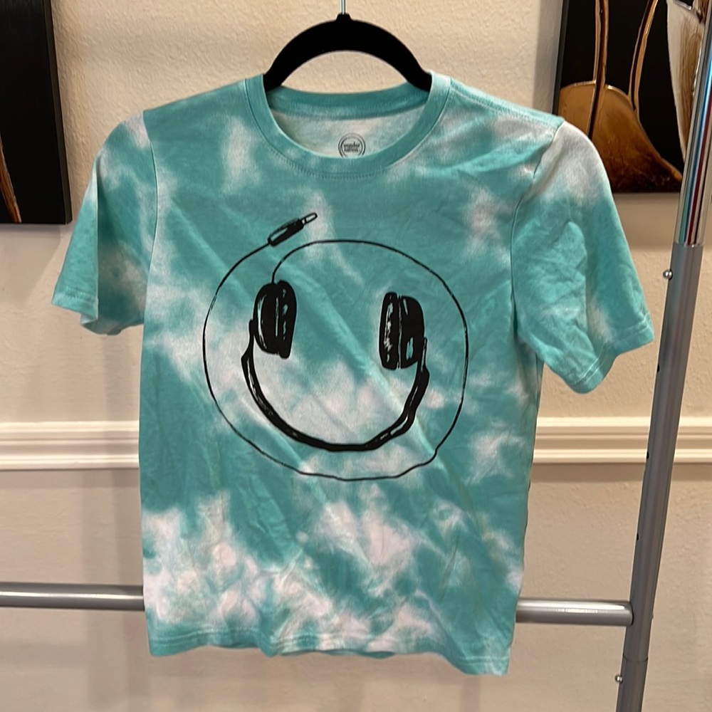 Teal colored smiley face shirt